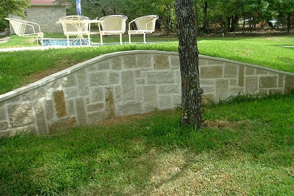 landscape drains - retaining wall in backyard