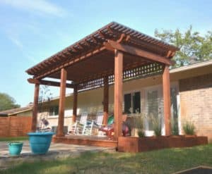 design features for year-round outdoor living - wood patio cover in backyard