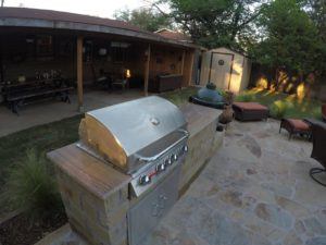 outdoor kitchen - outdoor kitchen with grill and sandstone countertop