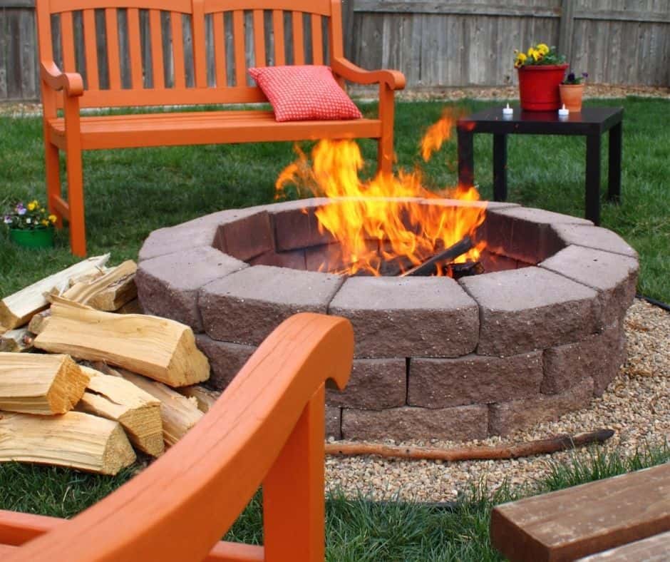 stone fire pit with wood burning and seating