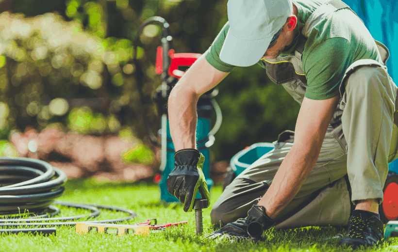 man-fixing-sprinkler