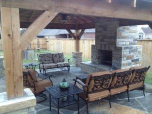 hardscape construction - outdoor living area with seating and fireplace